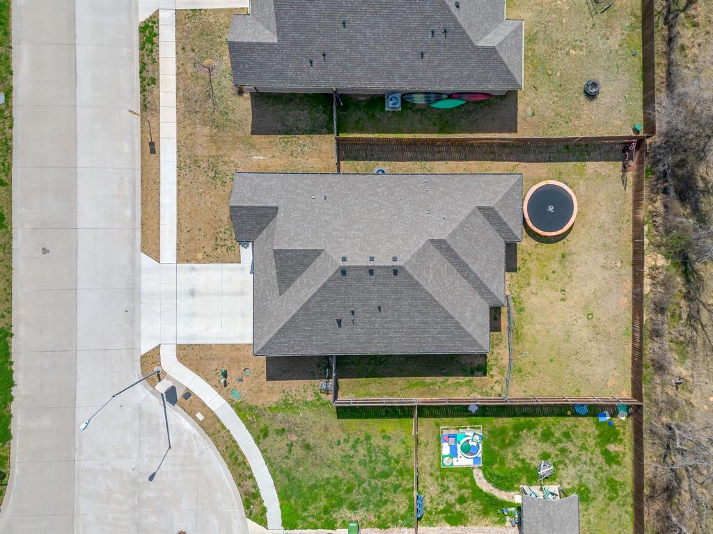 409 Titus Drive Springtown, TX 76082 - Photo 37 of 39 an aerial view of a house with a swimming pool
