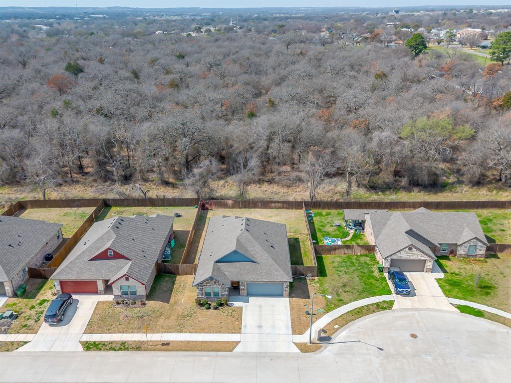 409 Titus Drive Springtown, TX 76082 - Photo 38 of 39 an aerial view of a house with a swimming pool