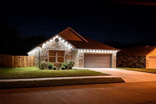 409 Titus Drive Springtown, TX 76082 - Photo 39 of 39 a front view of a house with a yard