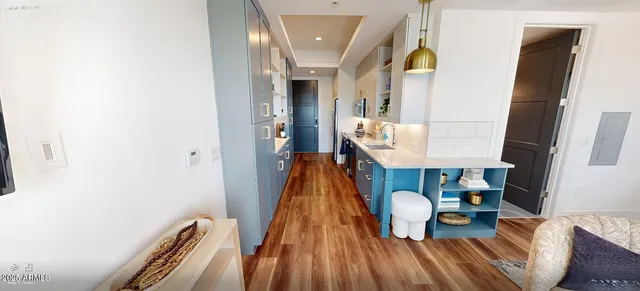 a view of living room with furniture and wooden floor