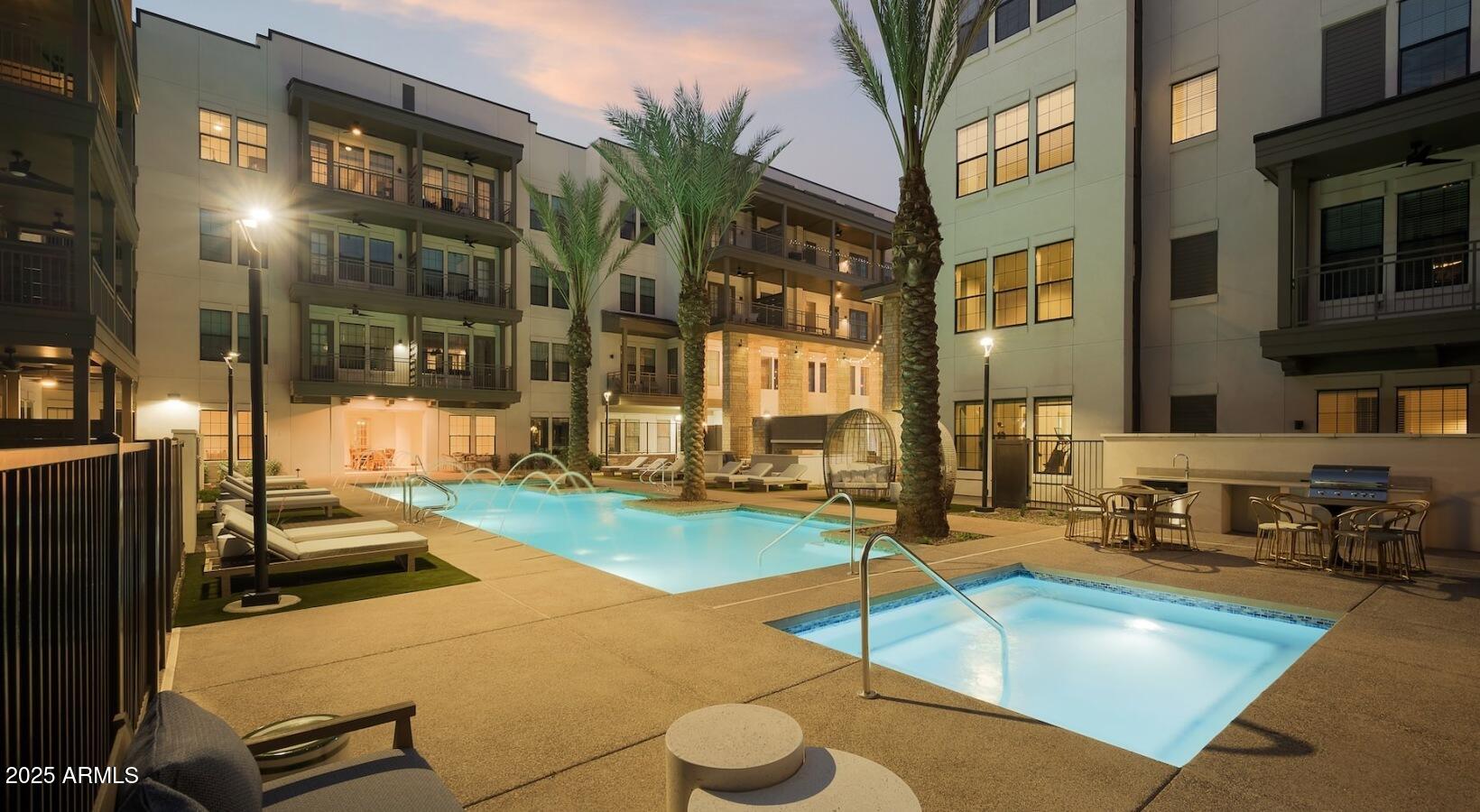 98 South River Drive, Unit S2 Tempe, AZ 85288 - Photo 7 of 14 a view of a swimming pool with outdoor seating
