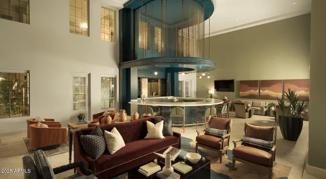 a living room with furniture and a large window