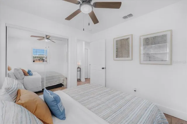 a bedroom with a bed and a cabinets