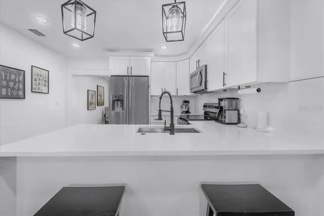 a living room with furniture a rug and a table