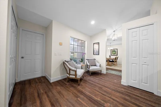 a kitchen with a sink appliances cabinets and furniture