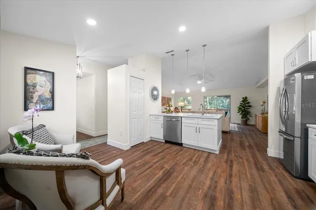 a kitchen with a white stove top oven and refrigerator