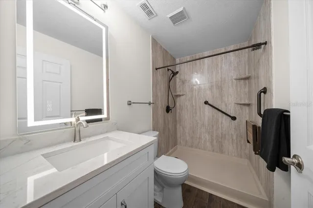 a view of a room with wooden floor