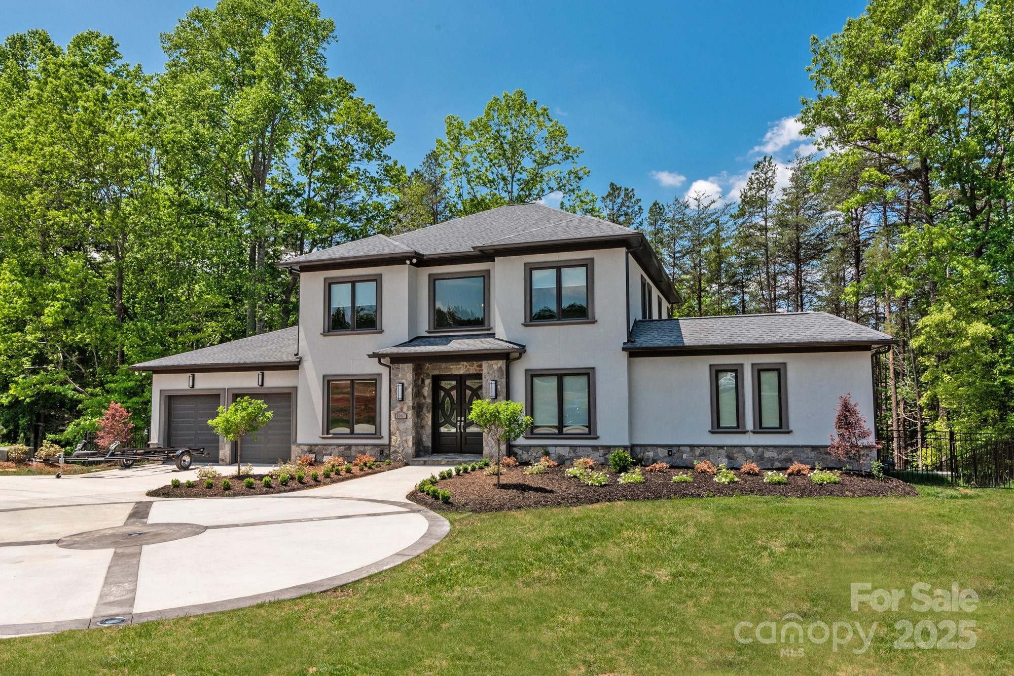 a view of a house with a yard patio and fire pit