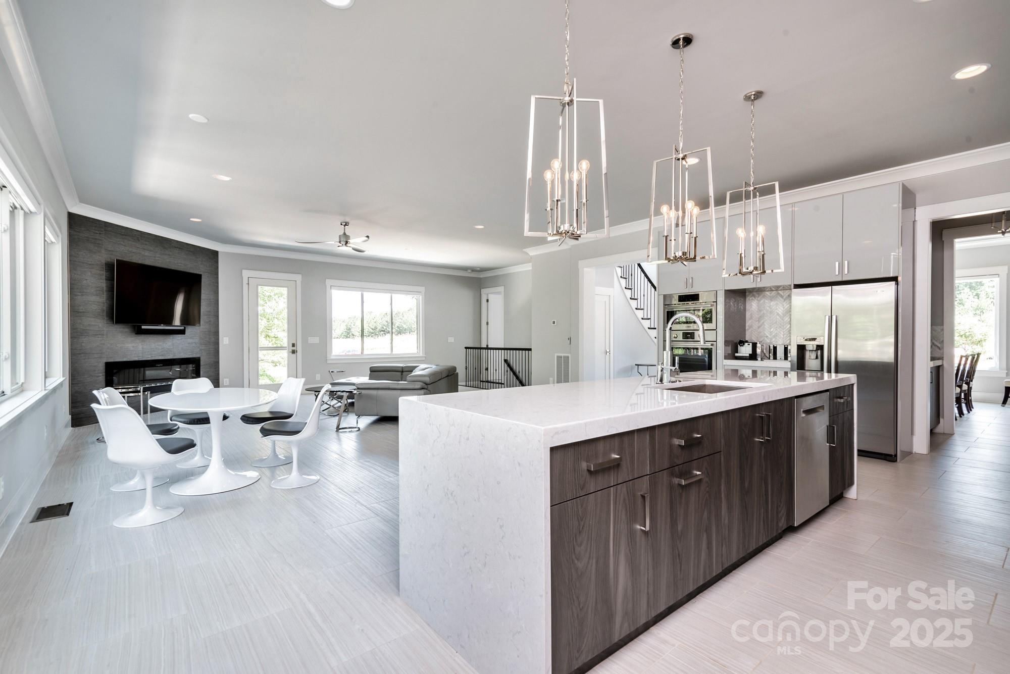 4067 Rivendell Road Denver, NC 28037 - Photo 12 of 37 a large white kitchen with lots of counter space and appliances