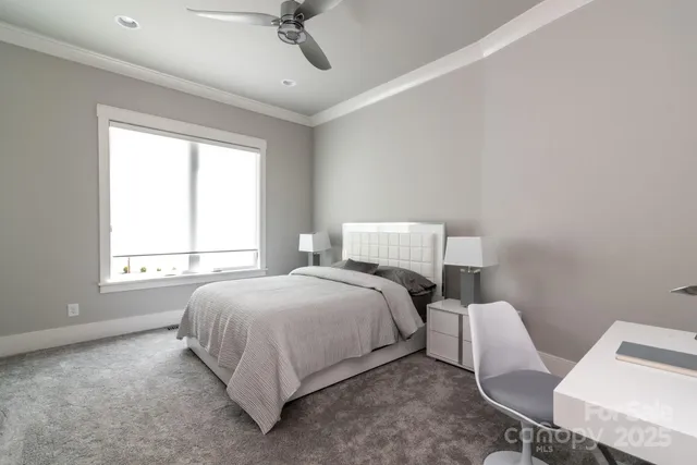 a bed room with a bed and a chair