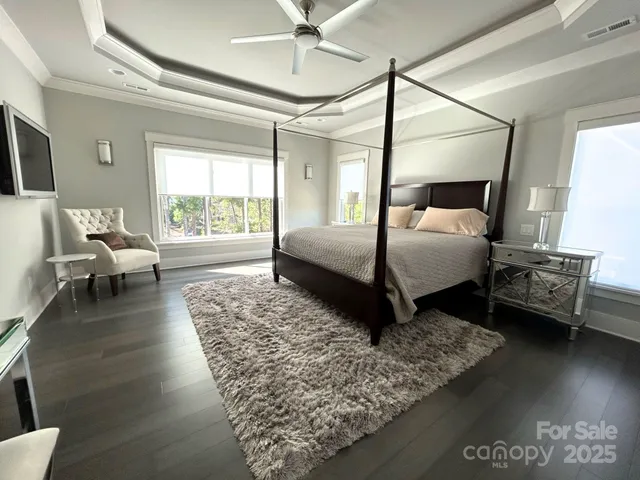 a living room with couches and a coffee table next to a window
