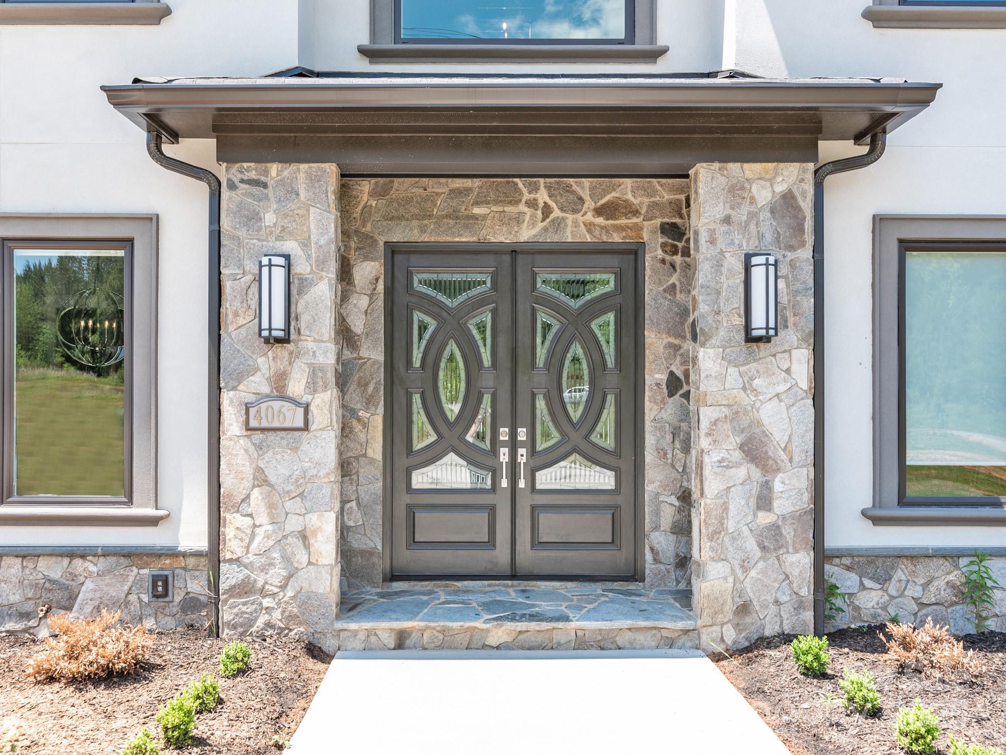 4067 Rivendell Road Denver, NC 28037 - Photo 2 of 37 a front view of a house with a rug