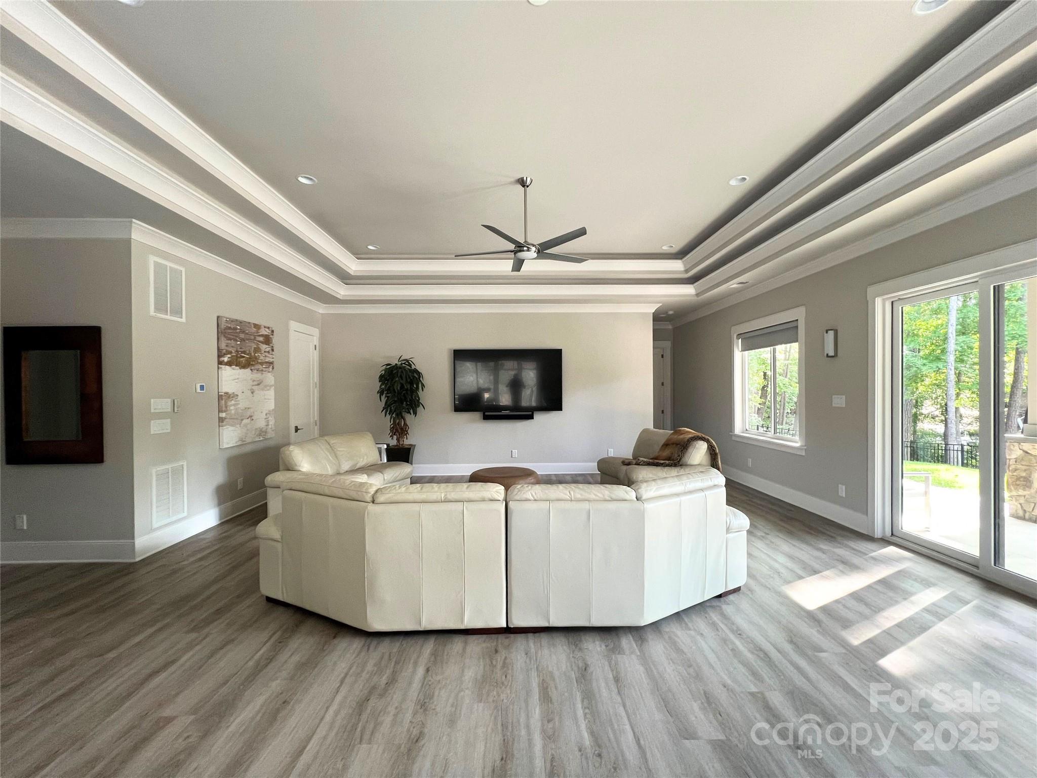 4067 Rivendell Road Denver, NC 28037 - Photo 24 of 37 a living room with furniture and a flat screen tv