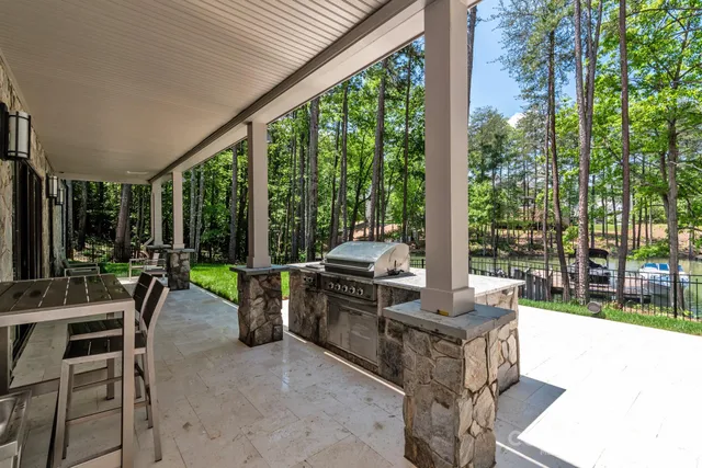 a view of a lake with a table and chairs