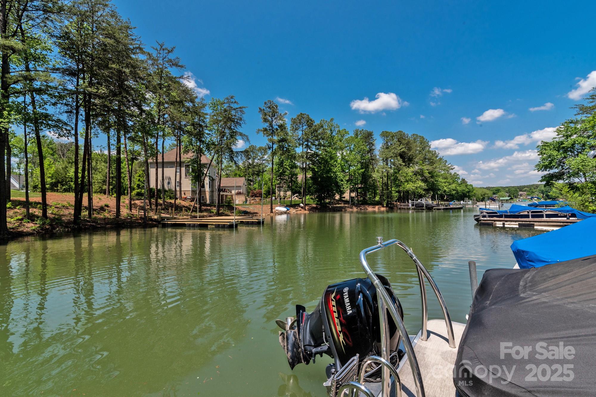 4067 Rivendell Road Denver, NC 28037 - Photo 37 of 37 a view of a lake with a table and chairs