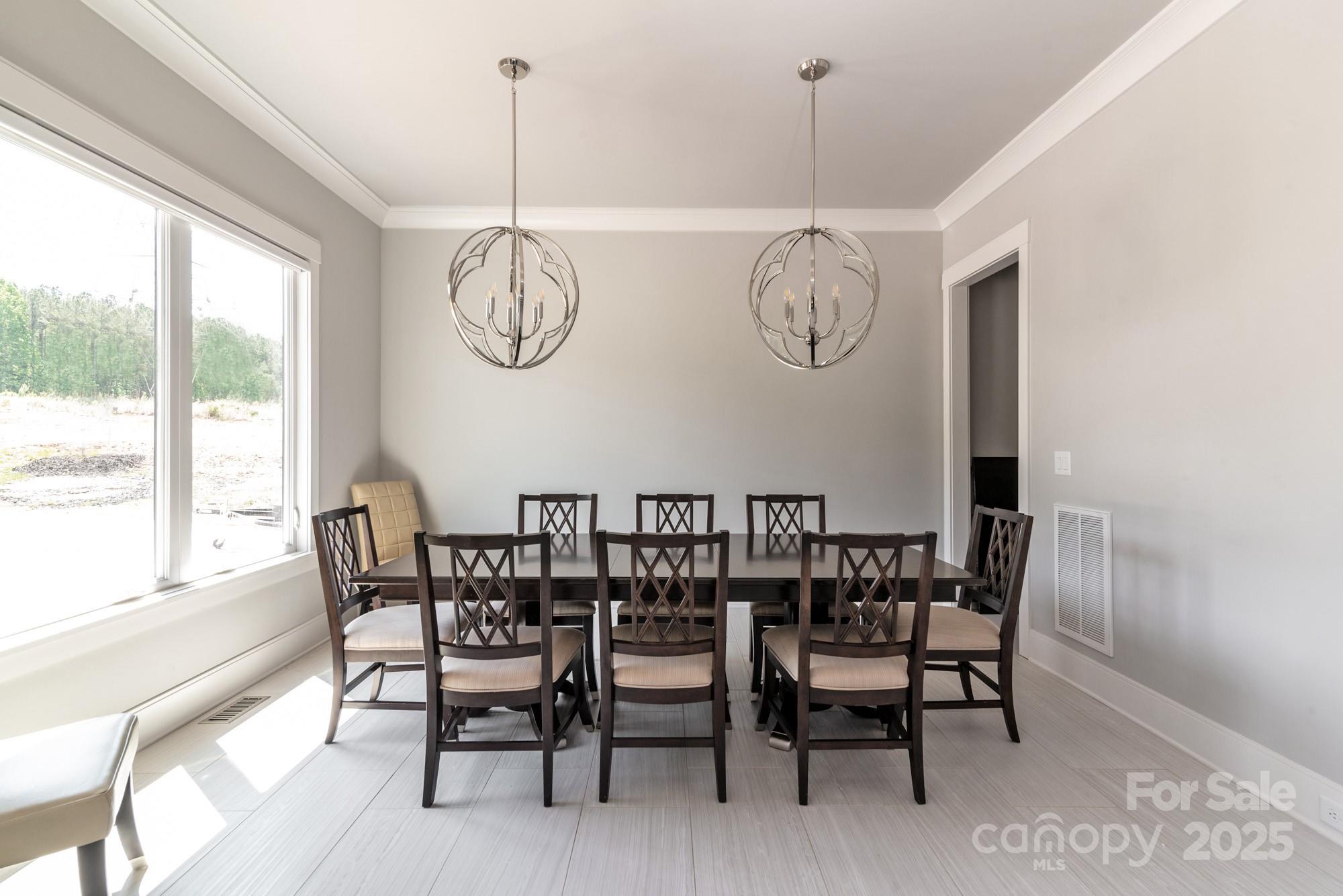 4067 Rivendell Road Denver, NC 28037 - Photo 4 of 37 a view of a dining room with furniture window and outside view