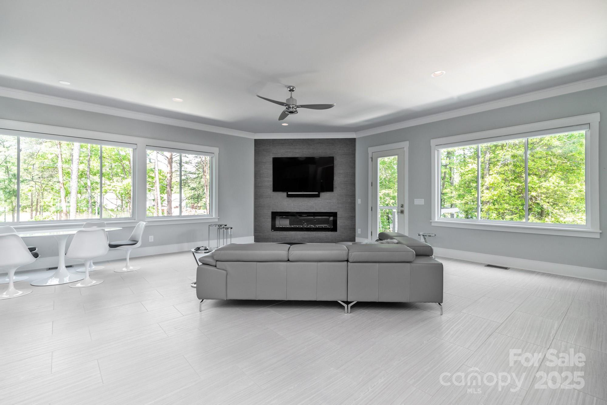 4067 Rivendell Road Denver, NC 28037 - Photo 5 of 37 a living room with furniture and a flat screen tv