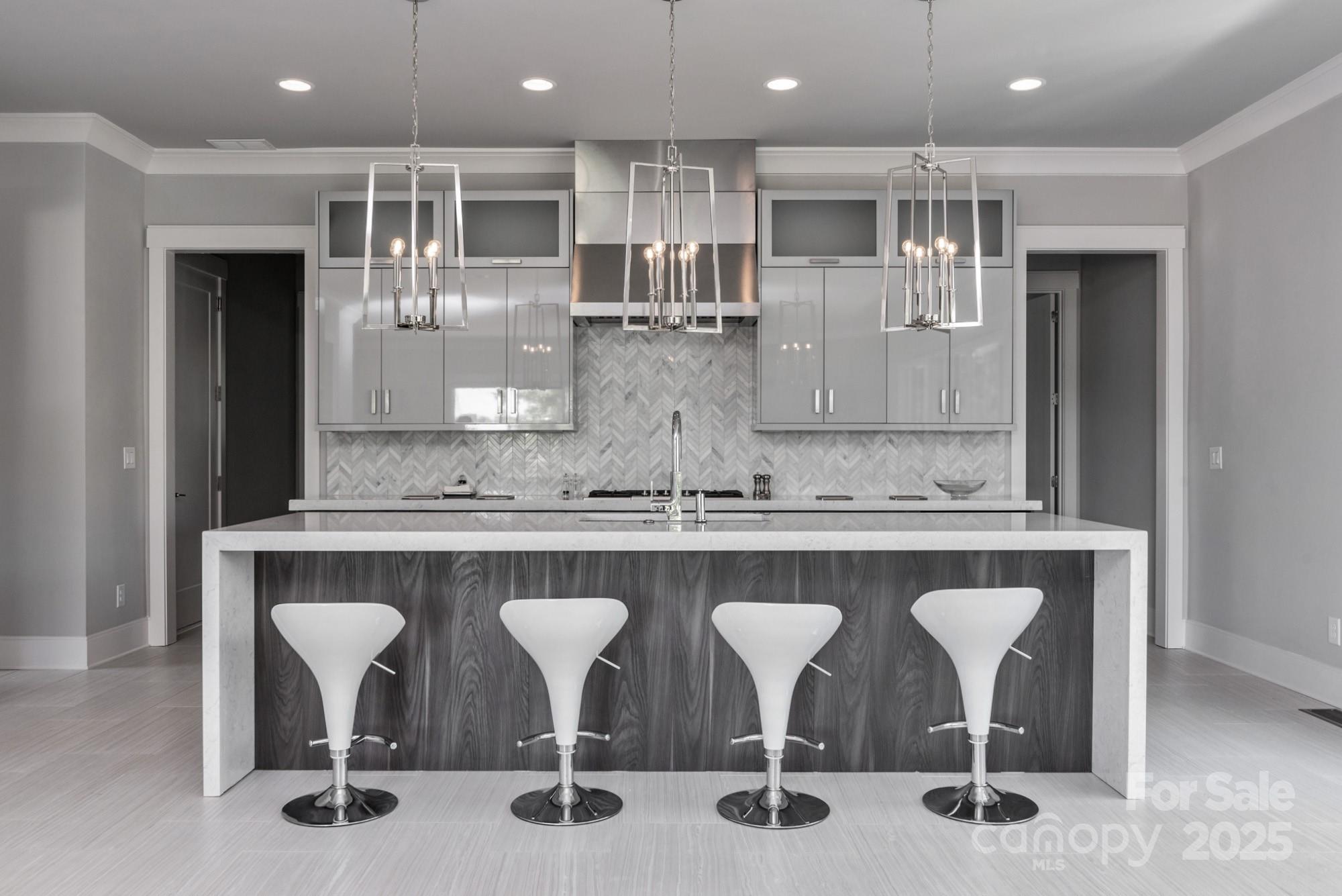 4067 Rivendell Road Denver, NC 28037 - Photo 7 of 37 a kitchen with a table and chairs in it