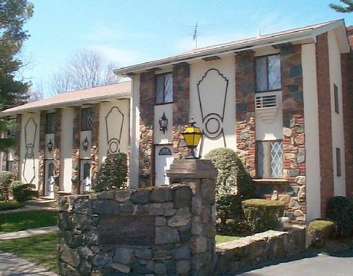 54 Hope Street, Unit B Stamford, CT 06906 - Photo 1 of 1 a front view of house with a garden