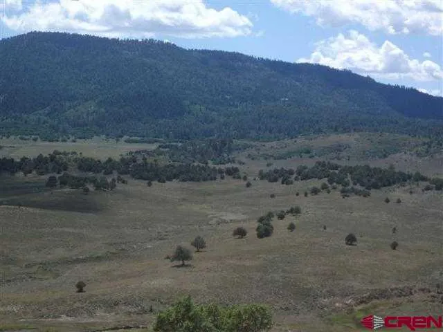 a view of a lake and mountain in back