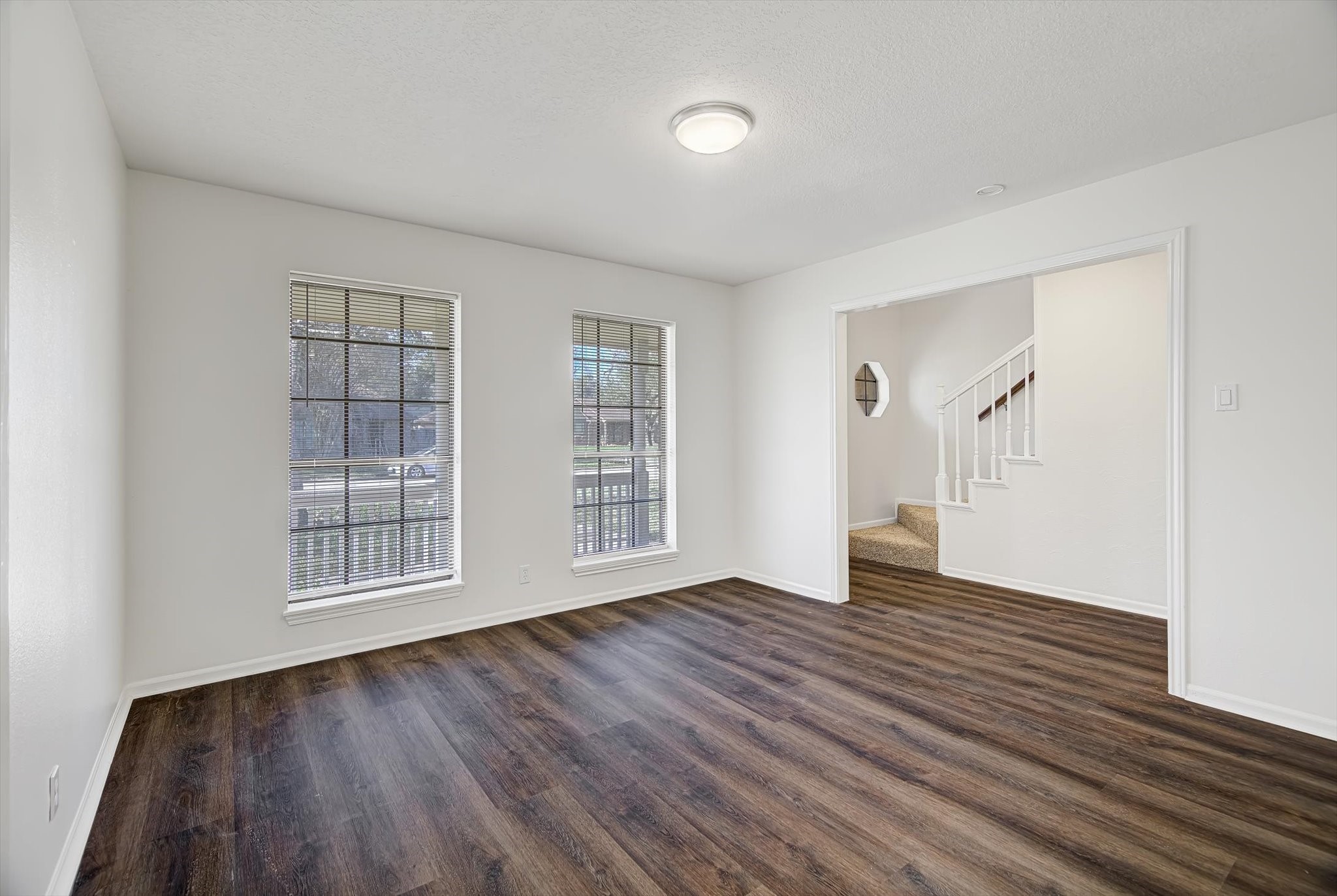 216 Any Way Street Lake Jackson, TX 77566 - Photo 12 of 49 an empty room with wooden floor and windows