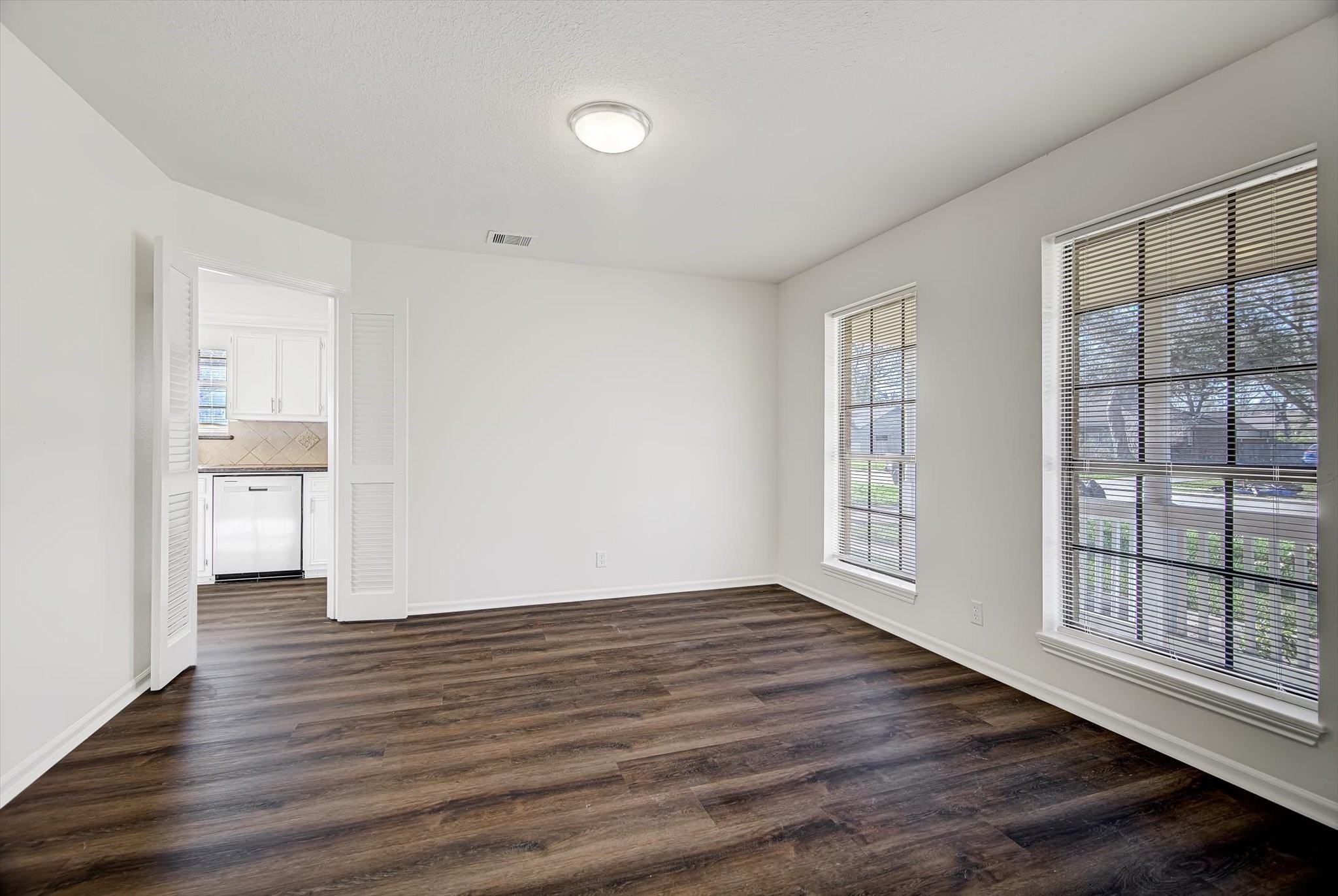 216 Any Way Street Lake Jackson, TX 77566 - Photo 14 of 49 wooden floor in an empty room with a window