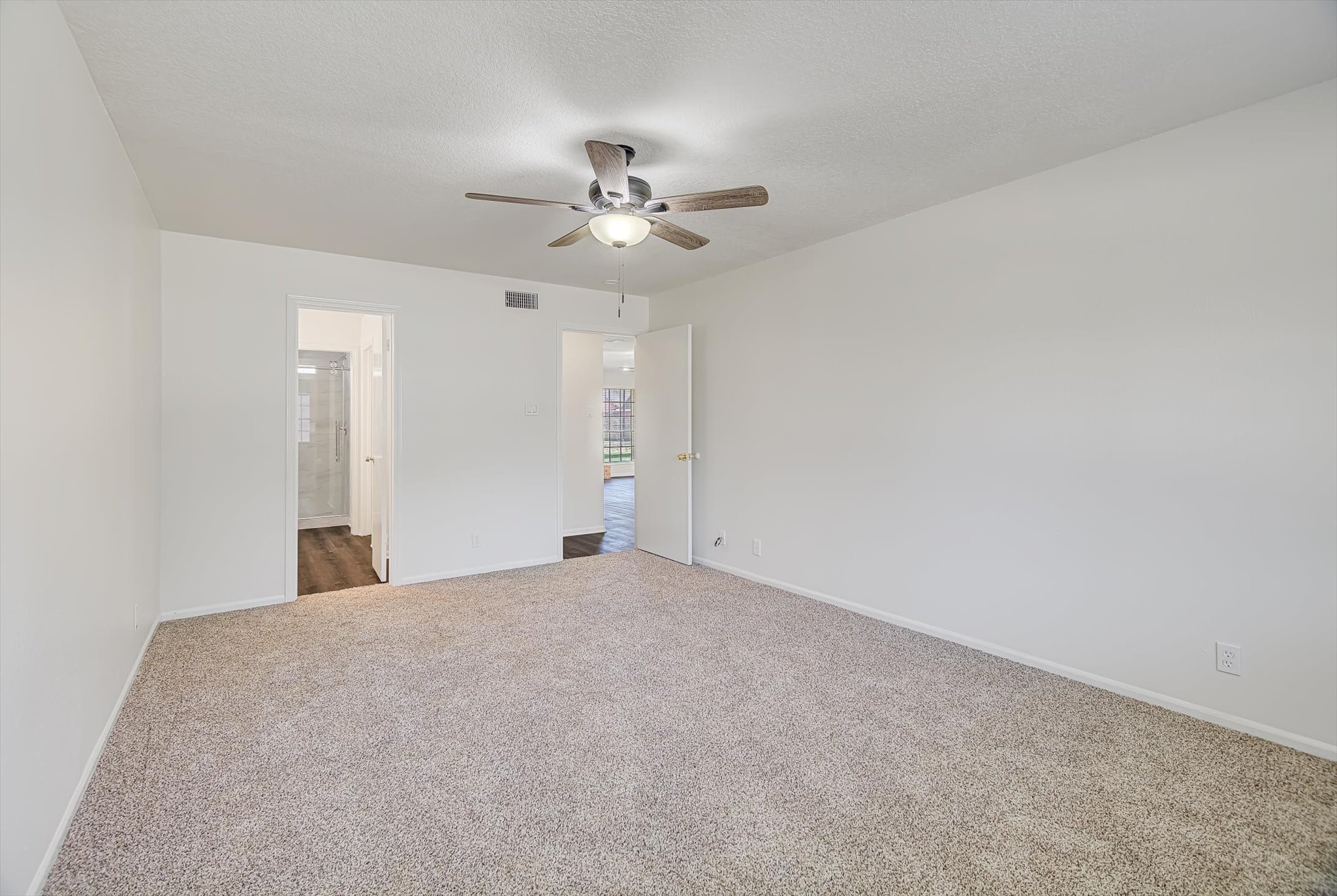 216 Any Way Street Lake Jackson, TX 77566 - Photo 28 of 49 a view of an empty room with a ceiling fan