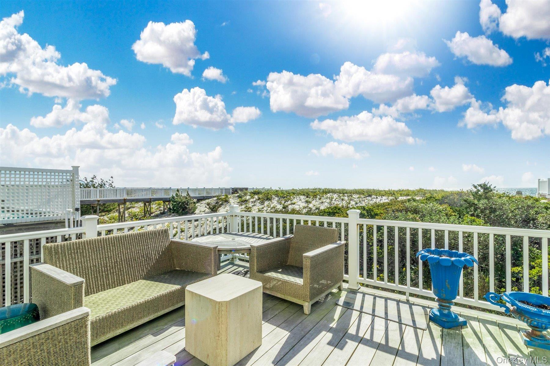 803 Dune Road West Hampton Dunes, NY 11978 - Photo 7 of 8 a view of a balcony with wooden floor