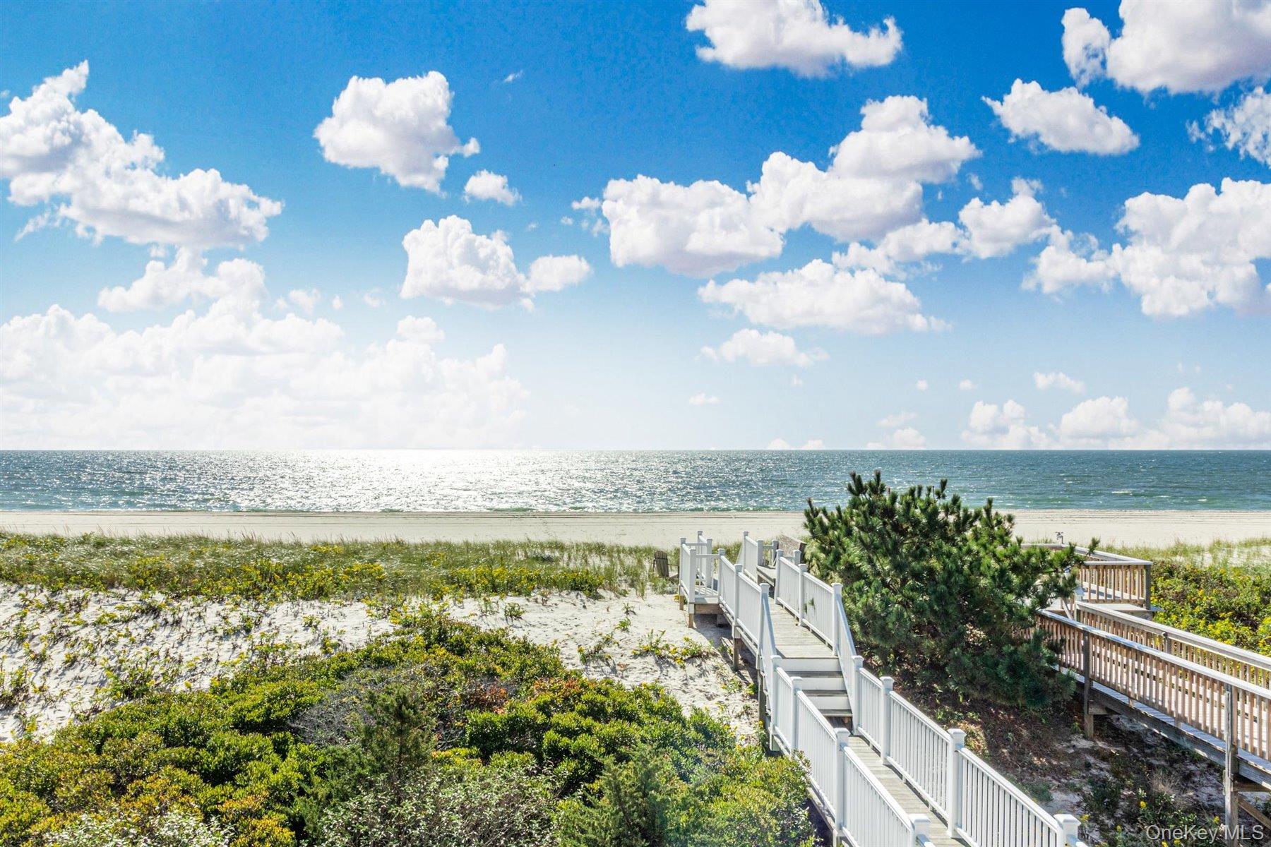 803 Dune Road West Hampton Dunes, NY 11978 - Photo 8 of 8 a view of a lake with a city