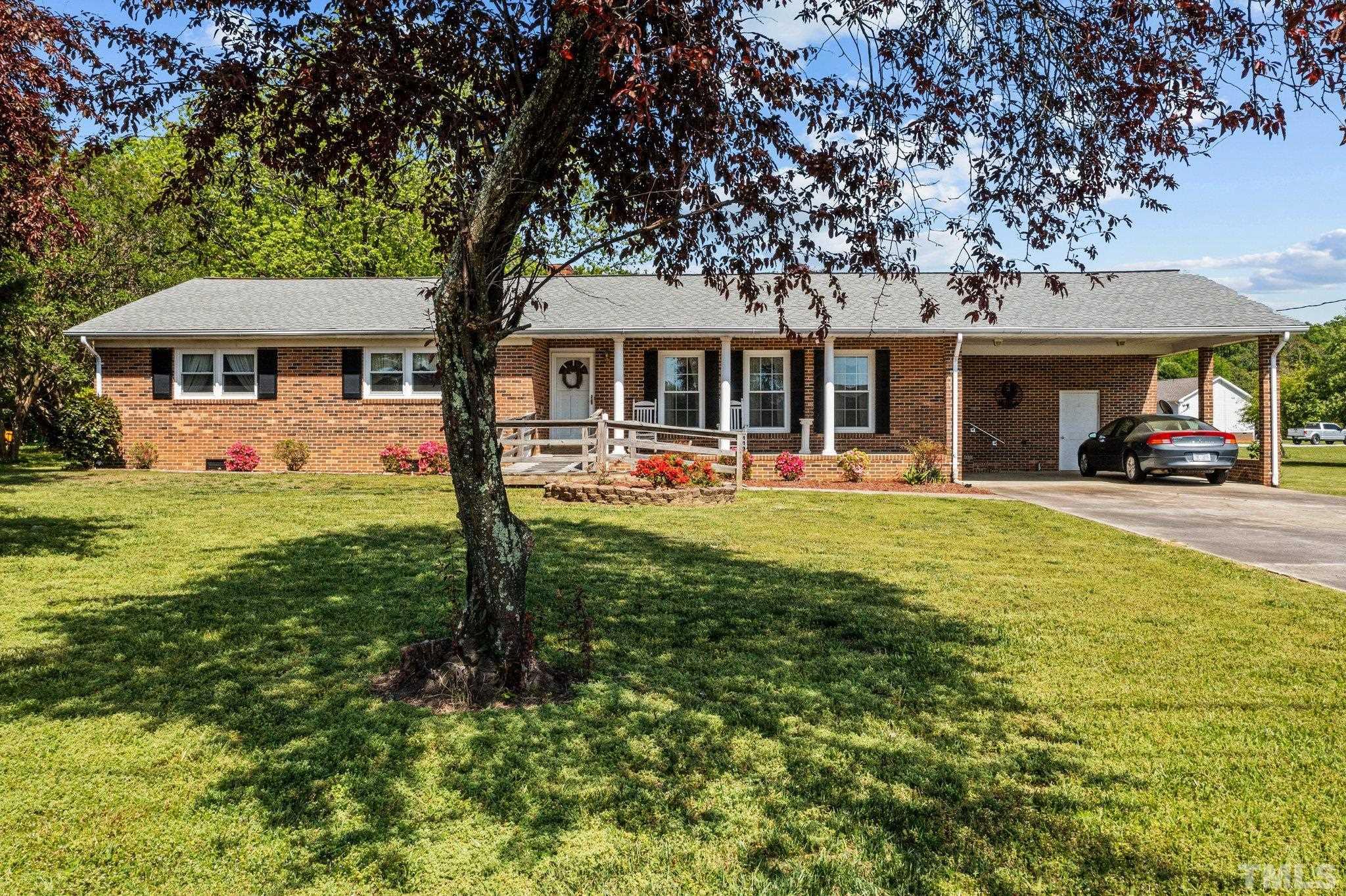 2255 Blalock Dairy Road Roxboro, NC 27574 - Photo 3 of 27 a front view of a house with garden