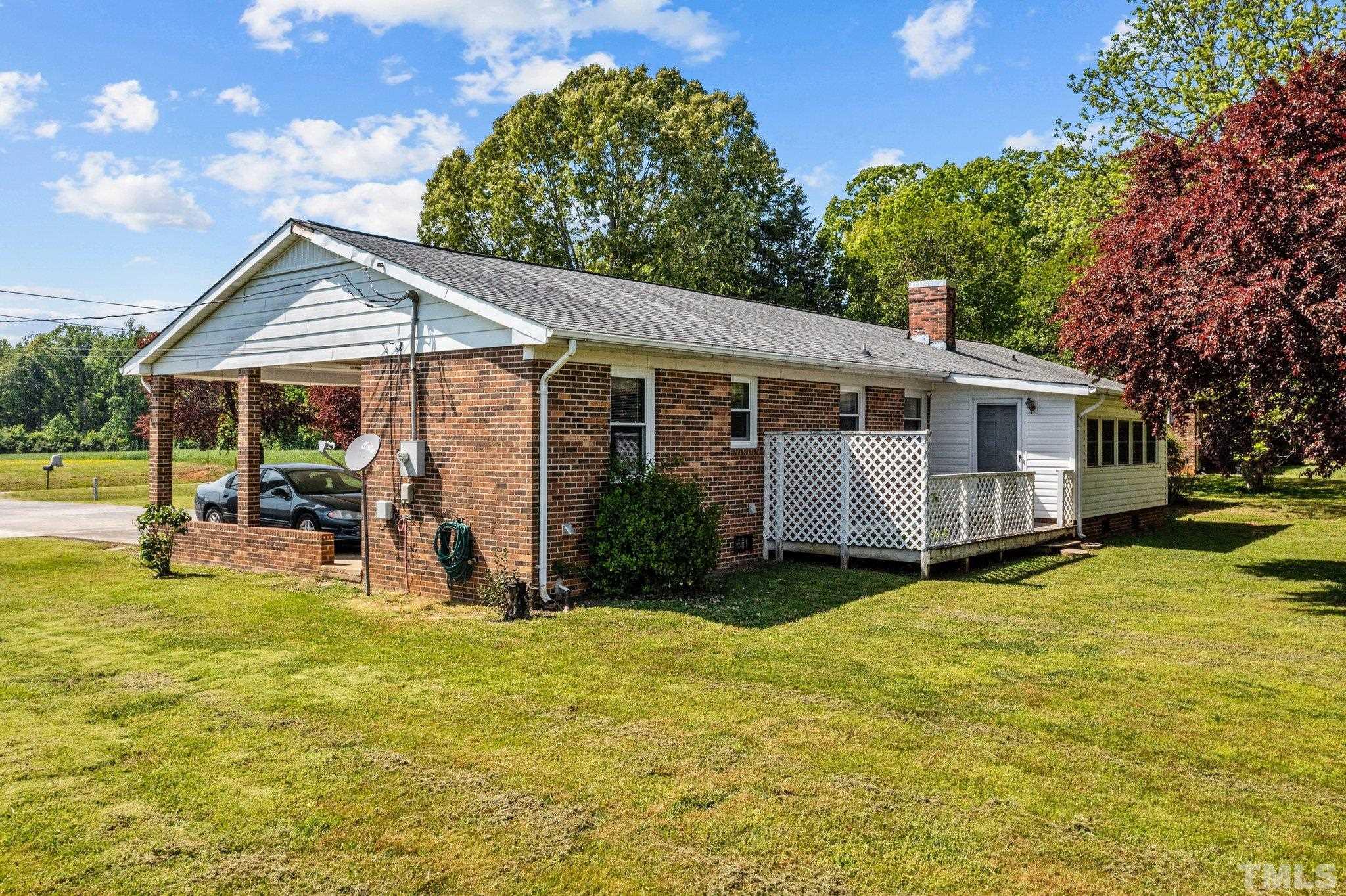 2255 Blalock Dairy Road Roxboro, NC 27574 - Photo 6 of 27 a view of a house with swimming pool and porch with furniture