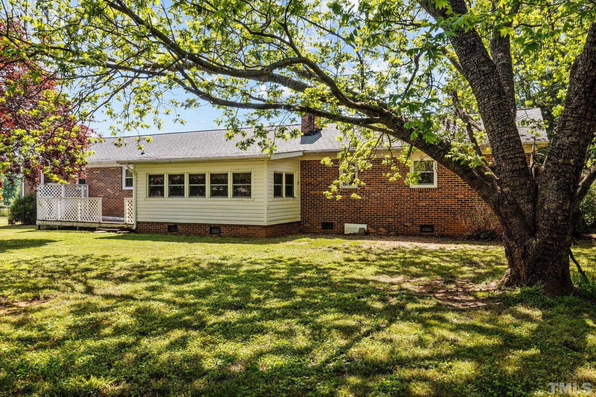 2255 Blalock Dairy Road Roxboro, NC 27574 - Photo 8 of 27 a view of a house with a large tree