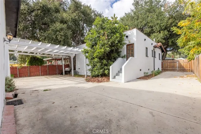 a view of a house with a yard and garage