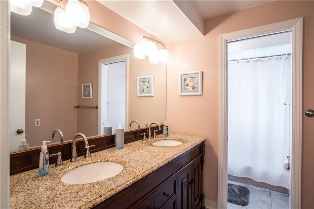1964 Redcoach Road Allison Park, PA 15101 - Photo 19 of 25 Updated hall bath with a double vanity and a separate room with the tub, shower and commode.