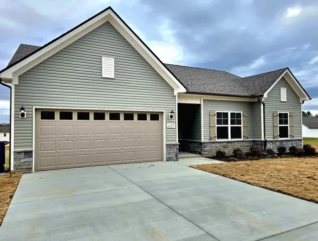 a front view of a house with yard