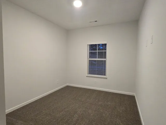 a view of a room with racks on the wall