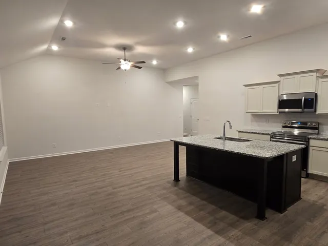 a view of kitchen with wooden floor