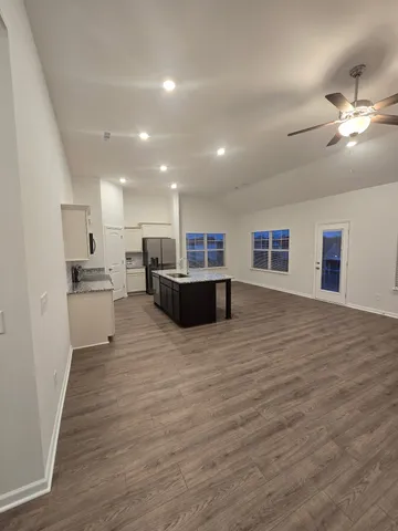 a view of a kitchen from the hallway