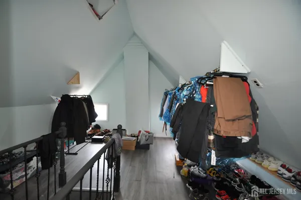 a view of a livingroom with furniture and gym equipment