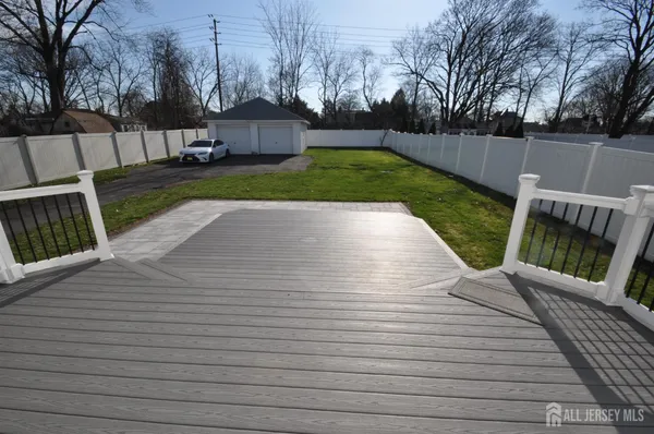 a view of a backyard with sitting area