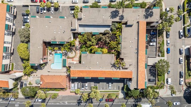 an aerial view of a house with a swimming pool