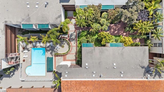 an aerial view of a house with swimming pool