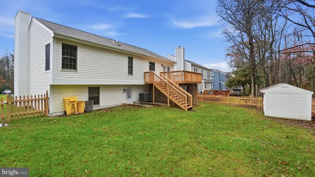 a view of a house with a yard and a cycle