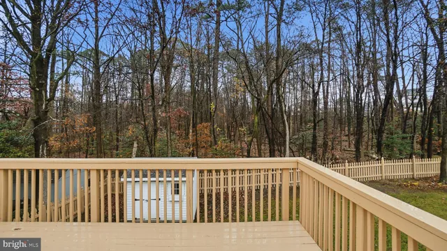 a balcony with trees in front of it