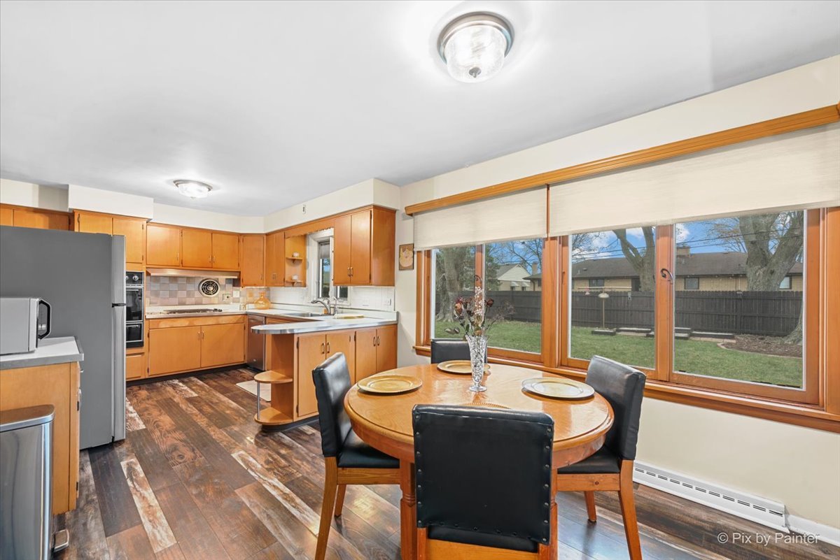 431 North Melrose Avenue Elgin, IL 60123 - Photo 16 of 32 a dining room with furniture and a large window