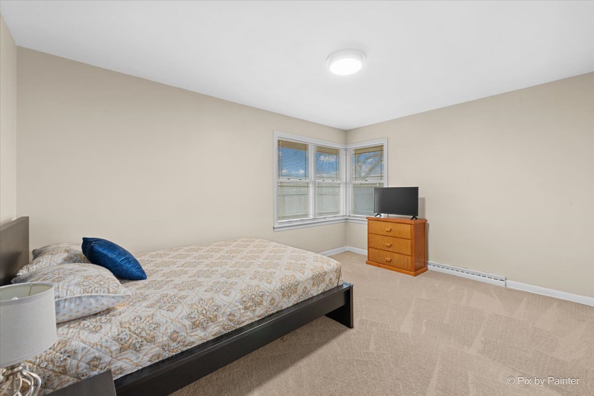 431 North Melrose Avenue Elgin, IL 60123 - Photo 8 of 32 a bedroom with a bed and a window