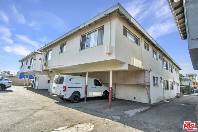 a bus parked in front of a house