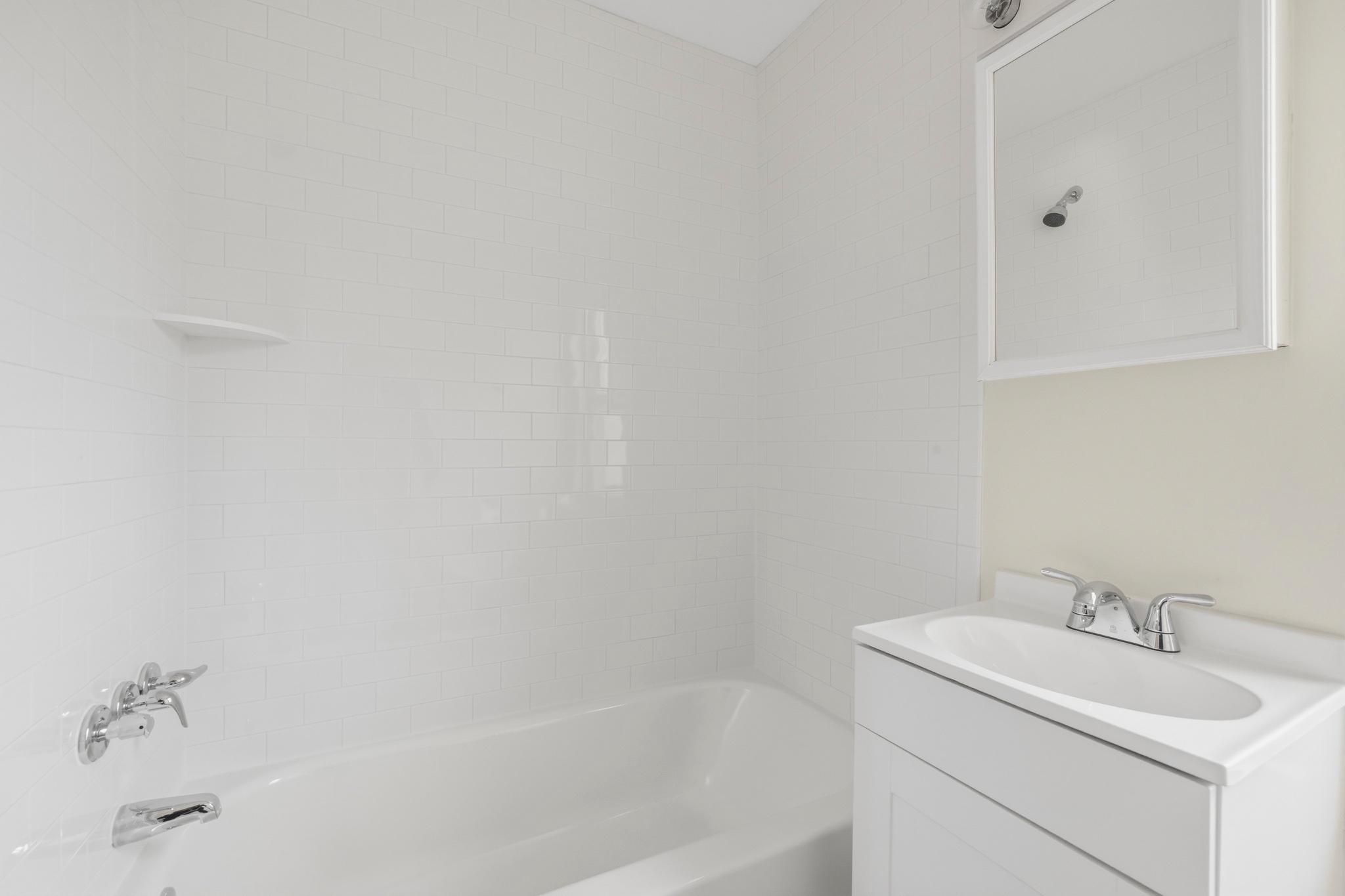 925 8th Street Northeast Washington, DC 20002 - Photo 22 of 24 a bathroom with a sink and a bathtub