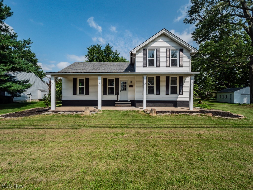 39330 Chestnut Ridge Road Elyria, OH 44035 - Photo 1 of 32 View of front of property with a front yard and a porch