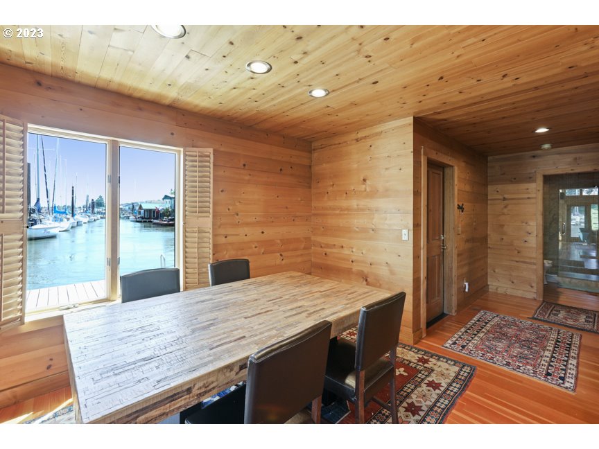 111 North Bridgeton Road, Unit E05 Portland, OR 97217 - Photo 25 of 42 a bathroom with a granite countertop sink a mirror and shower